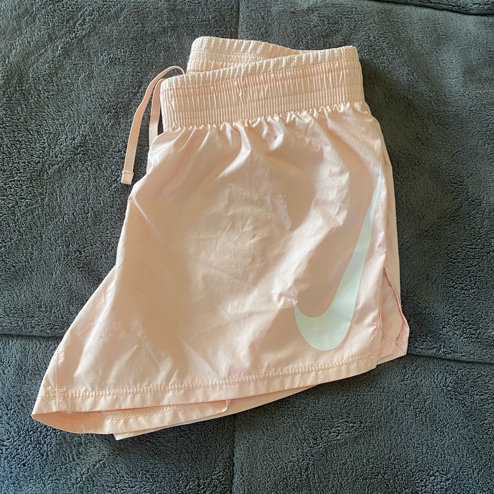 Light pink Nike running shorts